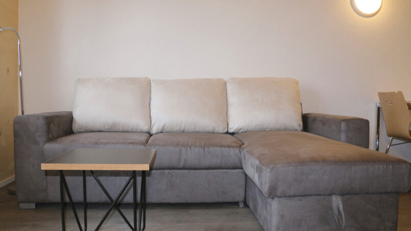 Gruppenhaus Sportlodge Gstaad - Wohnzimmer Couch